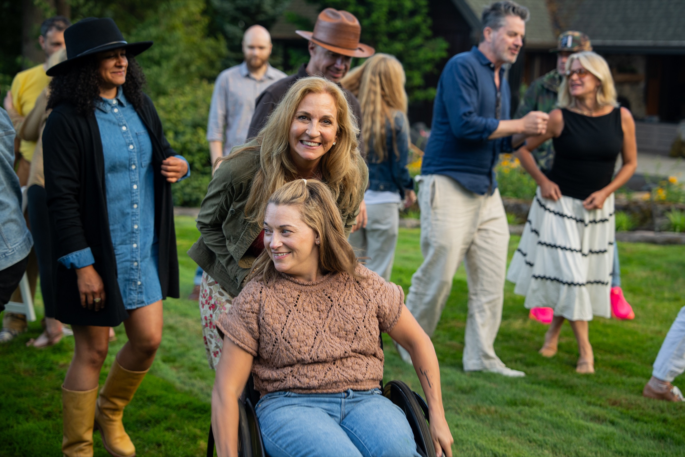 Michelle and Rilla sharing a joyful moment together on the lawn