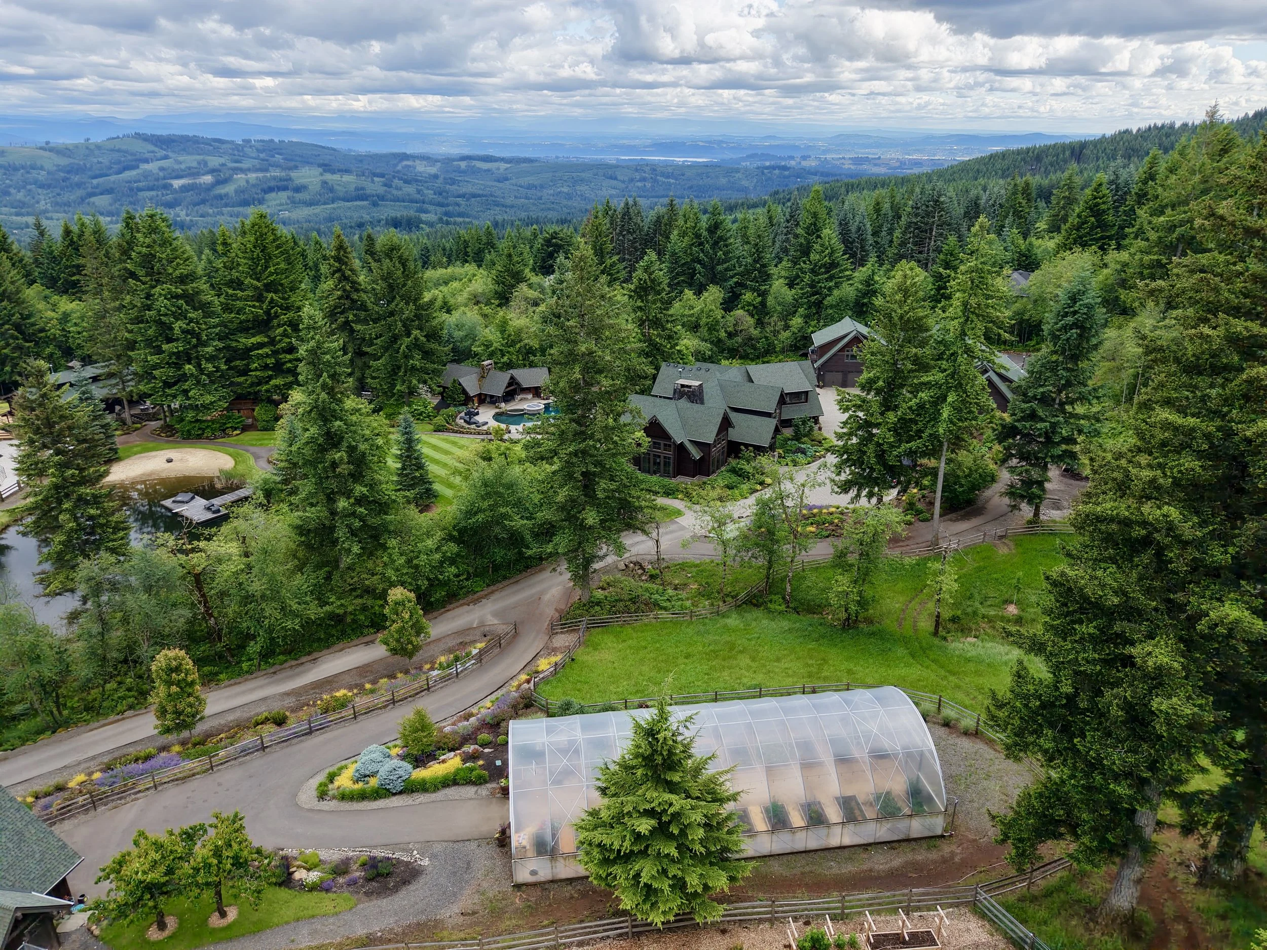 Aerial view of the retreat property surrounded by Pacific Northwest forest